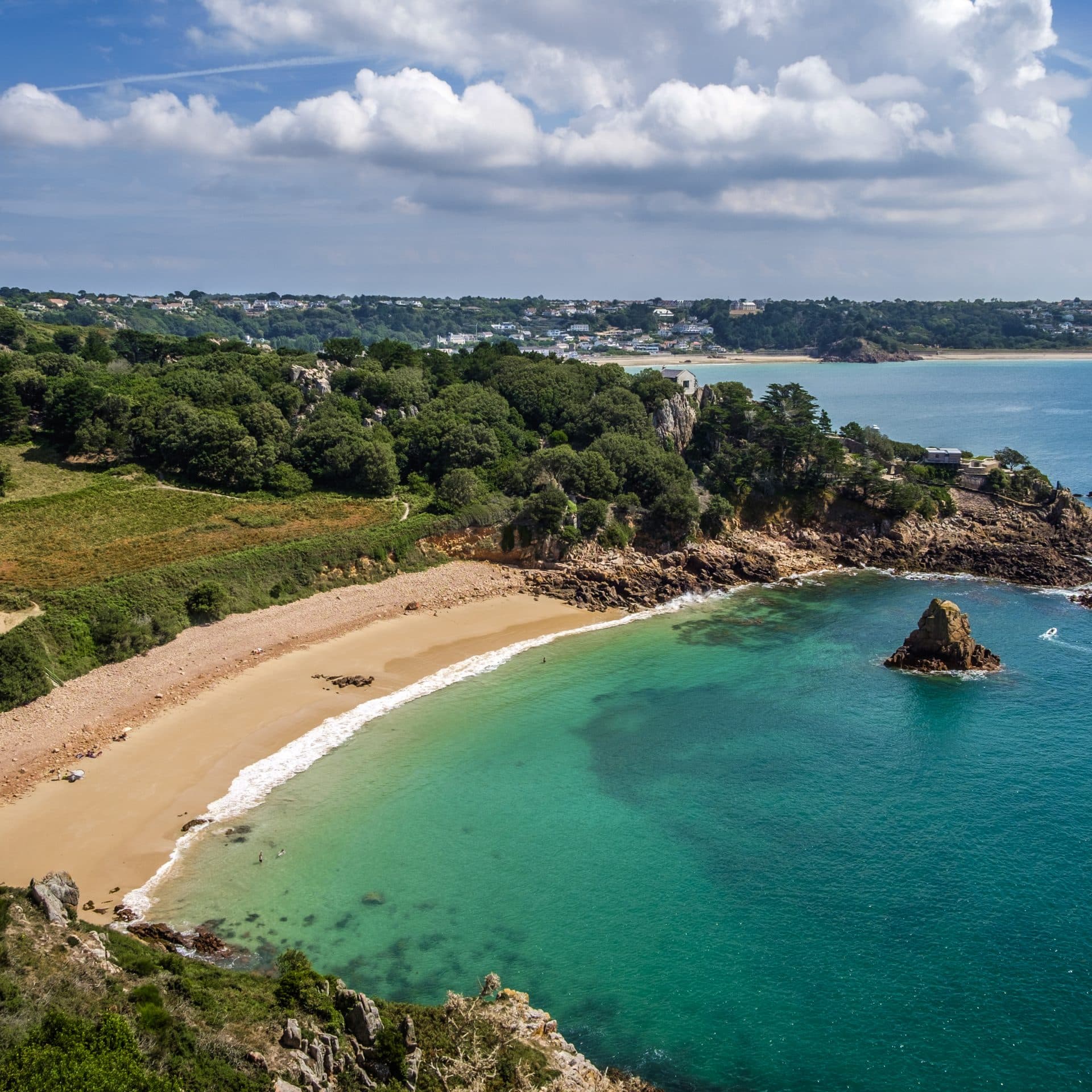 Yellow sandy 100m long beach in Jersey on a summers day.