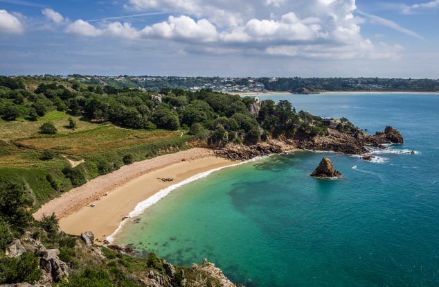 Yellow sandy 100m long beach in Jersey on a summers day.